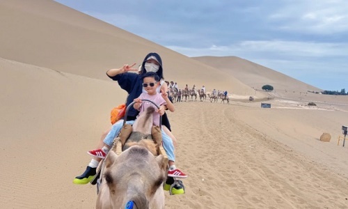 Camel-riding-at-Mingsha-Mountain-Dunhuang-tour Camel-riding-at-Mingsha-Mountain-Dunhuang-tour